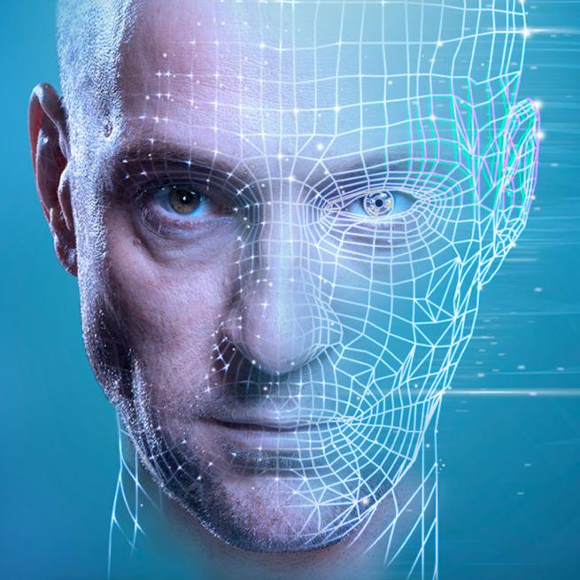 Image of Derren Brown's head looking stern, half of which looks like it is being scanned and has a grid. 