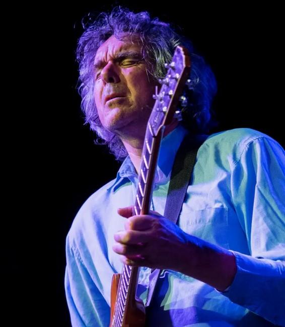 John Etheridge playing guitar