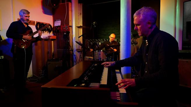 Picture of Bob Birch on organ, Robert Bromhead bass and Bruce Renshaw guitar