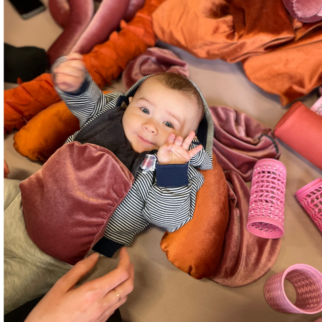 a baby with scrap objects