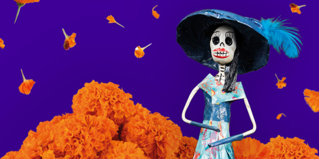 colourful skeleton wearing a big hat with marigolds in the background