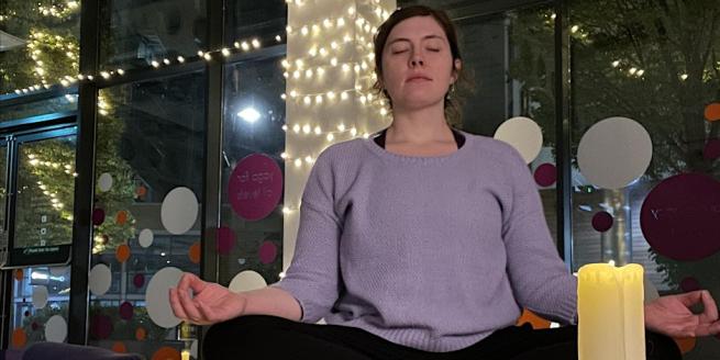 Yoga teacher Claire Reynolds sitting in meditation