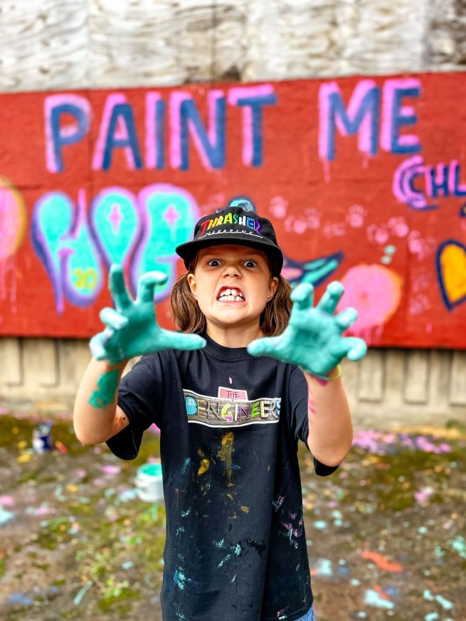 girl with green painty hands