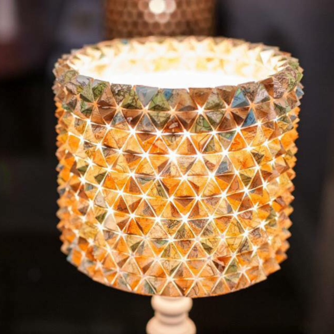 A lampshade constructed using pyramid shapes of Ordnance Survey maps.