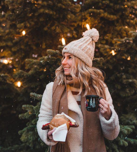 a woman enjoying a Christmassy snack