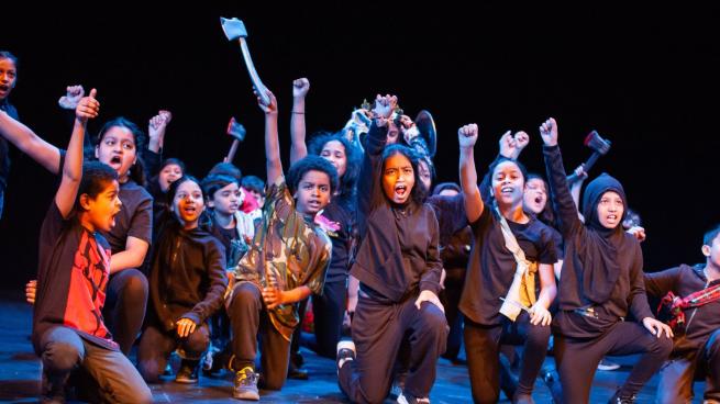 Young people in a group on stage