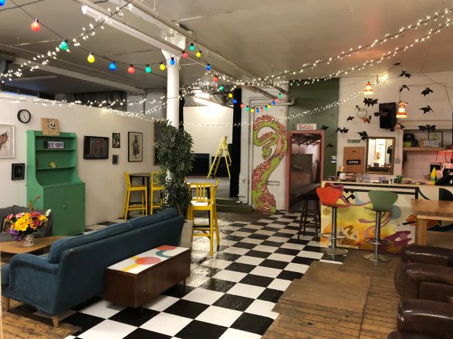 Assembly House bar area is shown with colourful decorations and artwork dotted throughout