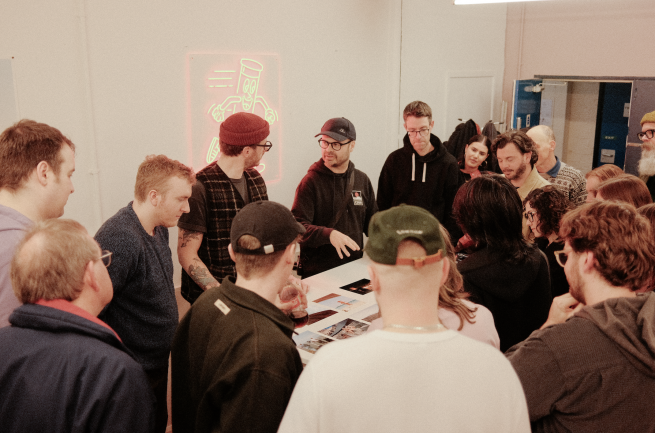 People gathered at a photo social at Take It Easy Lab, Leeds. 