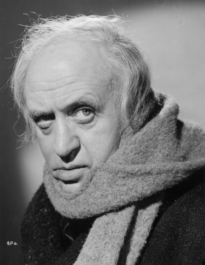 A black and white photograph from Scrooge featuring the titular character played by Alastair Sim.