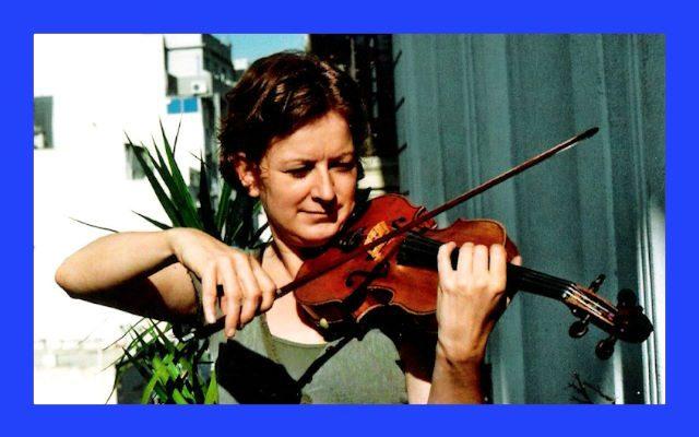 A woman playing the violin.