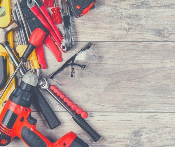 Photo of a variety of hand tools including screwdrivers, hammers and drill.