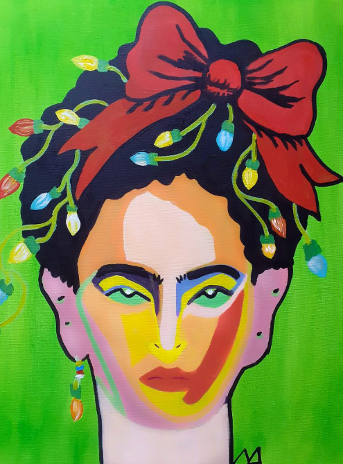 Frida Kahlo over a green background. She wears a red bow and christmas lights hang from her hair and her left ear.