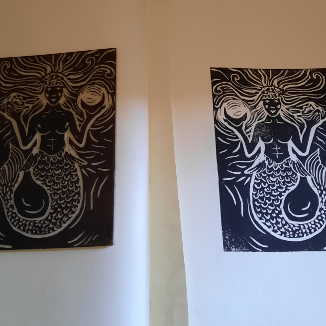 two lino prints of mermaids, using black ink.