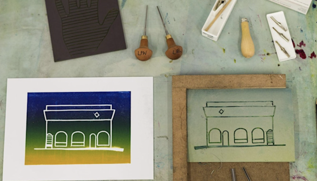 A lino printed image of a building in graduated colours of yellows, greens and blues, alongside the original lino plate and tools