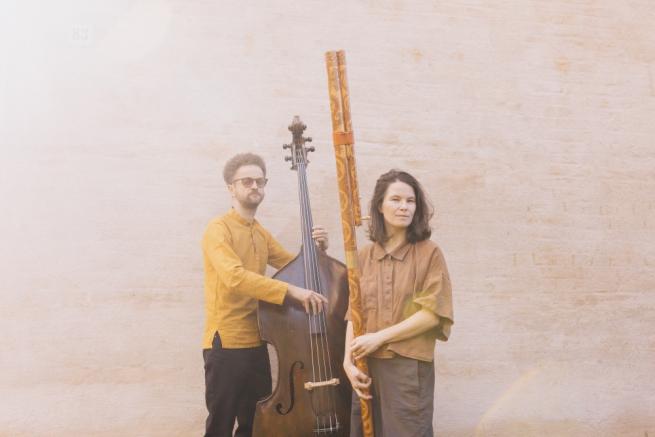 2 musicians with their instruments (a double bass and Slovak traditional fujara flute)