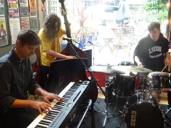 Jazz trio at Seven Arts bar playing piano bass and drums 