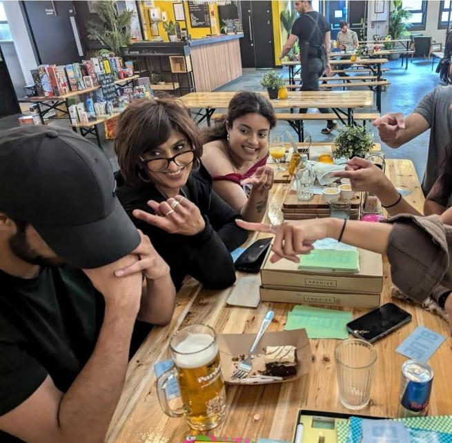 A group of people playing a boardgame