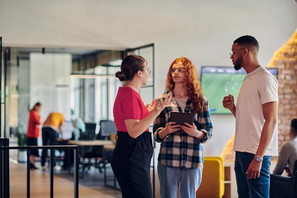 three people talking together