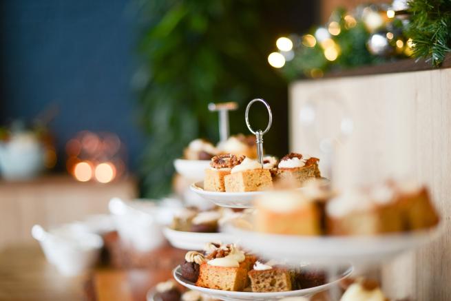 Selection of cakes displayed on cake stands