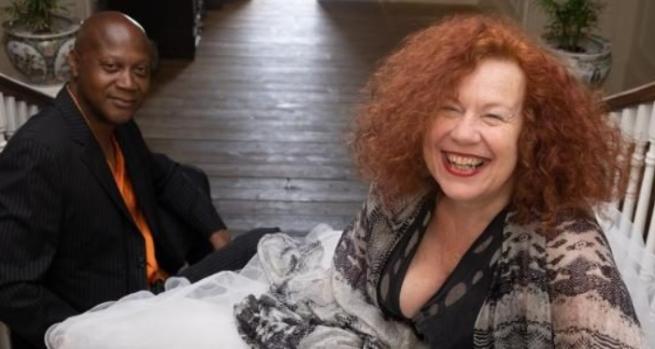 An image of Sarah Jane Morris sat on a staircase