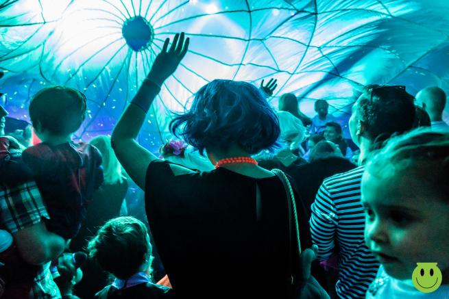 Women dancing under a parachute 