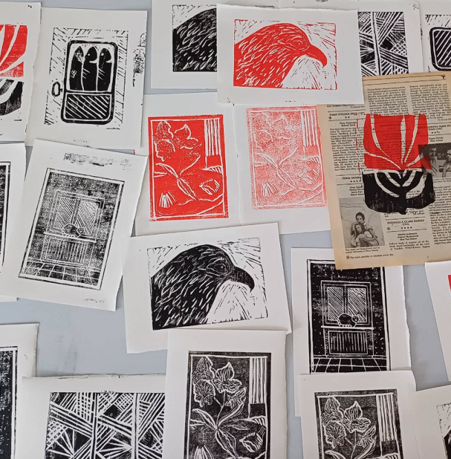 A selection of Lino prints in black and red ink