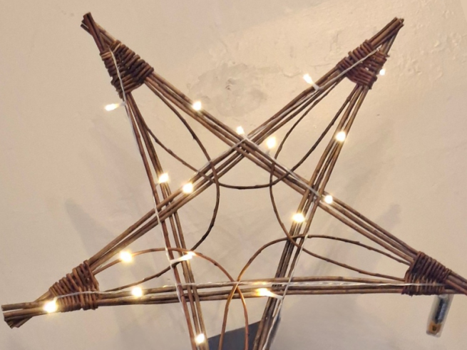 Star made from willow with fairy lights wrapped around it