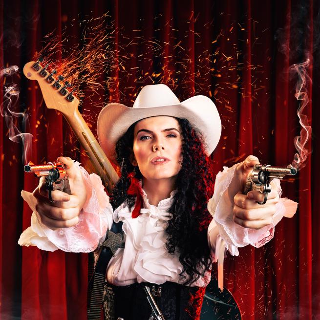 Jordan Gray with two smoking guns