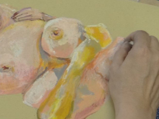 Life drawing sketch in yellow and pink pastel on yellow paper
