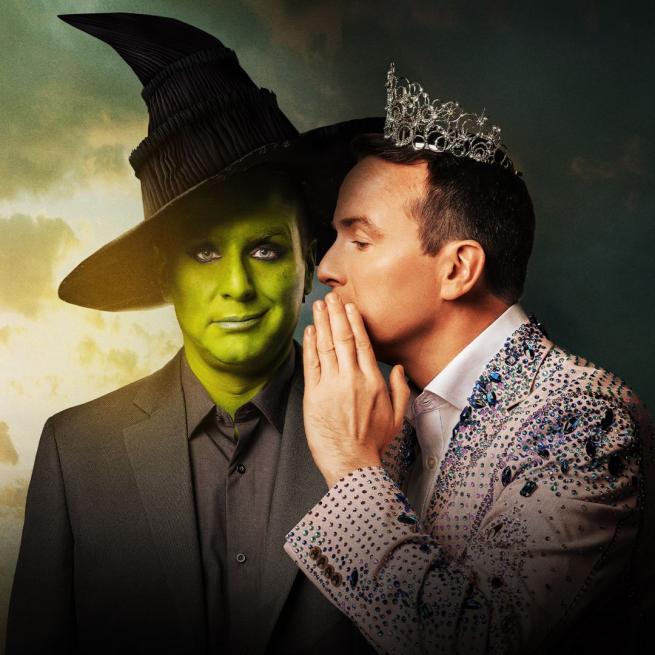 On the left, Matt Forde smirks in green face paint, witch hat and all black suit in the style of Wicked. On the right, a second Matt Forde is whispering, wearing a tiara and sequined pink outfit. The backdrop transitions from golden, green-tinted clouds to shadow.