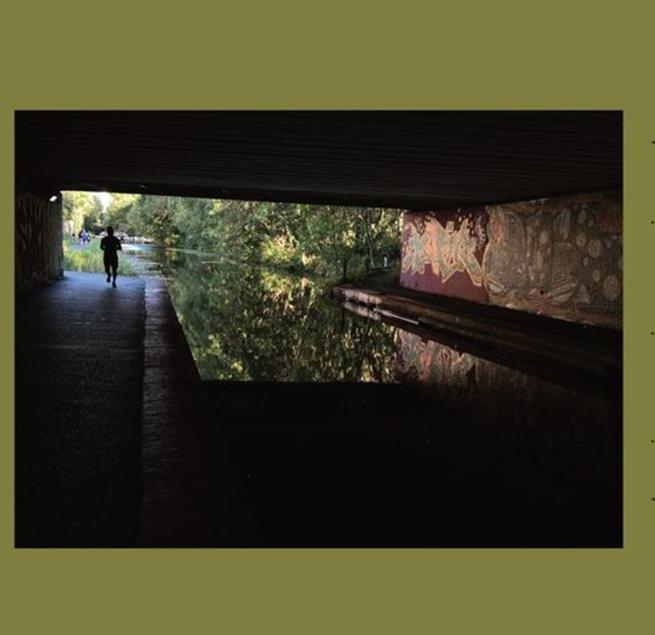 a person on a canal towpath