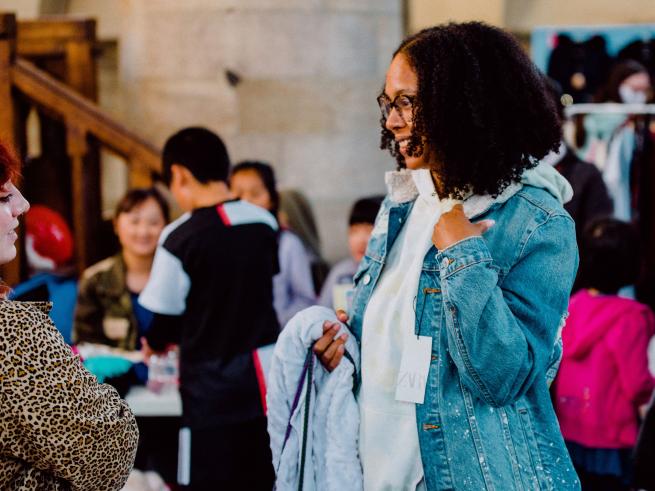Women trying on clothing at the Junk Sale
