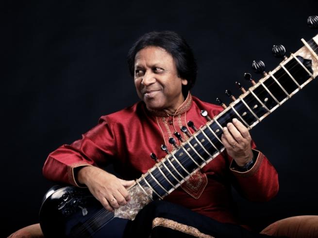 Man holding Sitar