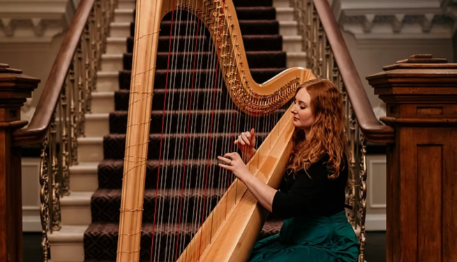 Image of woman playing a harp
