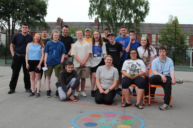 A group of happy participants posing for a picture. 