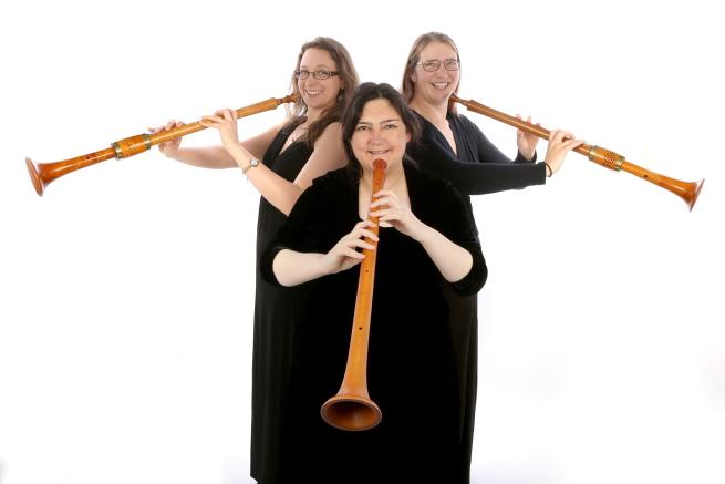 Three Ladies playing Medieval Trumpets