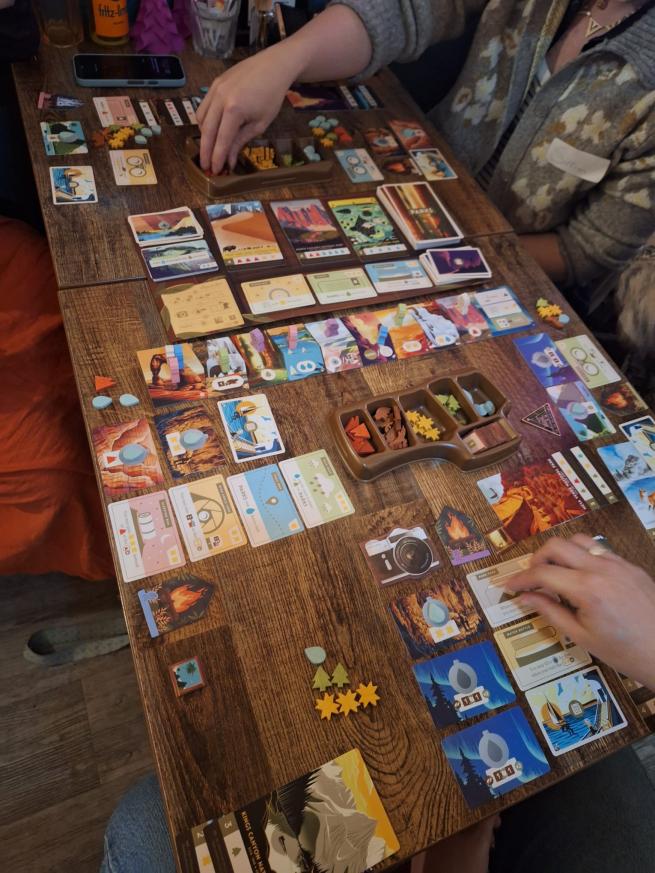 Group of people playing Parks - a table top board game