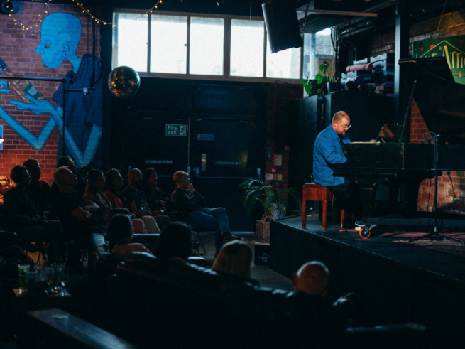 Simeon Walker plays the piano at The Attic