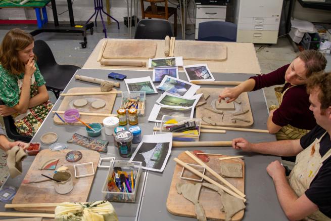 Pyramid member artists designing clay artworks inspired by John Atkinson Grimshaw artwork