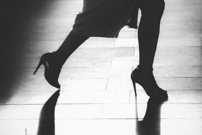 A woman dancing in high heels