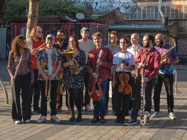 12 Musicians from the band Grande Familia with instruments 