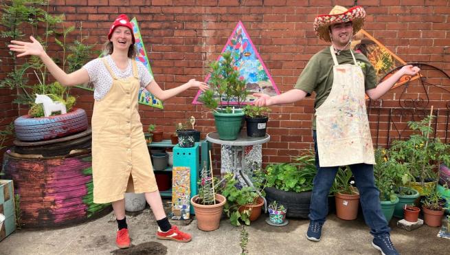 Pyramid artists Alice and William pose in the studio garden