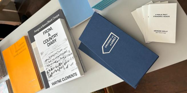 A set of artists' books on a table