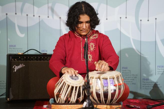 A man playing two drums 