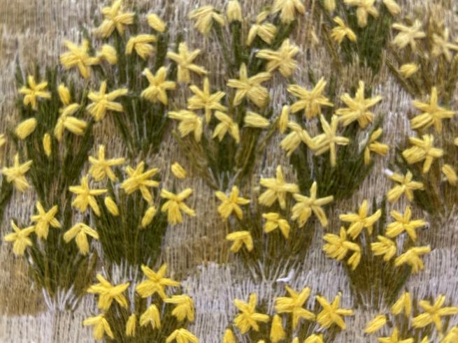 Embroidered flowers in yellow and green