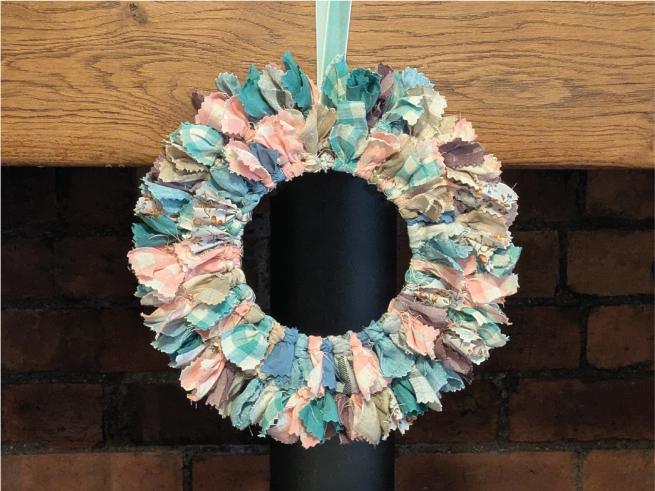 Image of rag wreath made from material scraps in spring colours
