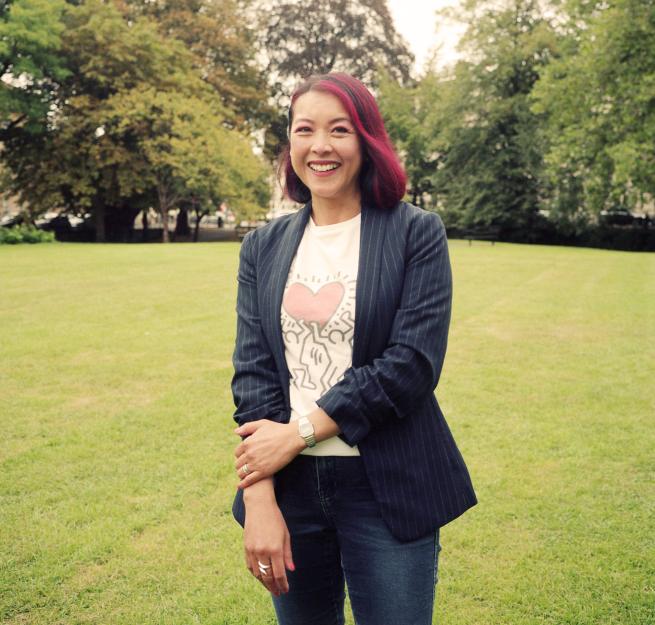 Author Sue Cheung stood in a park