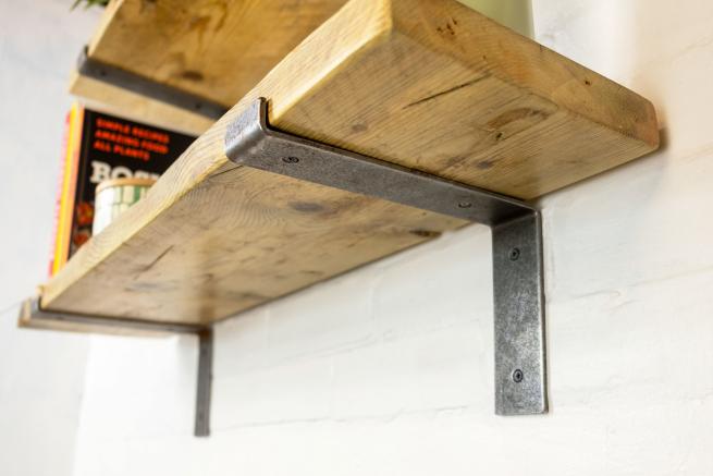 Scaffold board shelf with iron brackets
