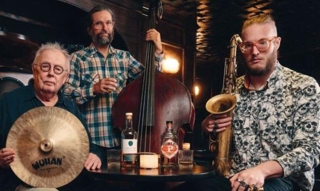 The members of QOW trio with instruments 