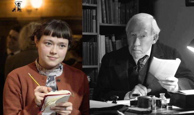 A young lady in a frumpy cardigan holds a notepad and pen, she has a piercing in her nose sits next to a distinguished grey haired man holding a sheet of paper